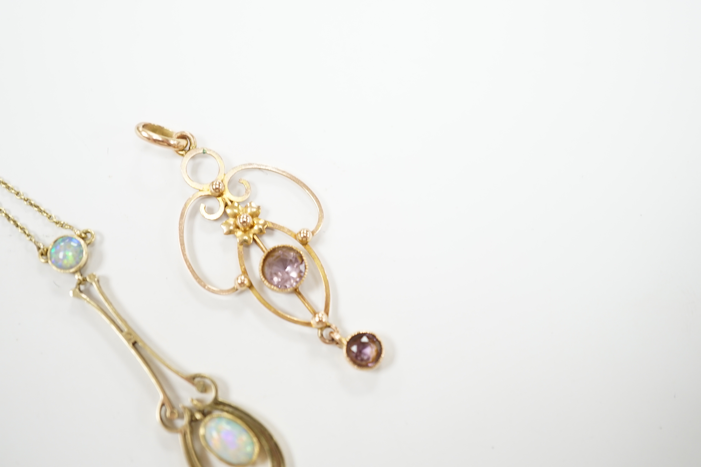 An Edwardian 15ct and two stone white opal set drop pendant necklace, chain unmarked, overall 46cm, and one other Edwardian 9ct and gem set pendant, 40mm.